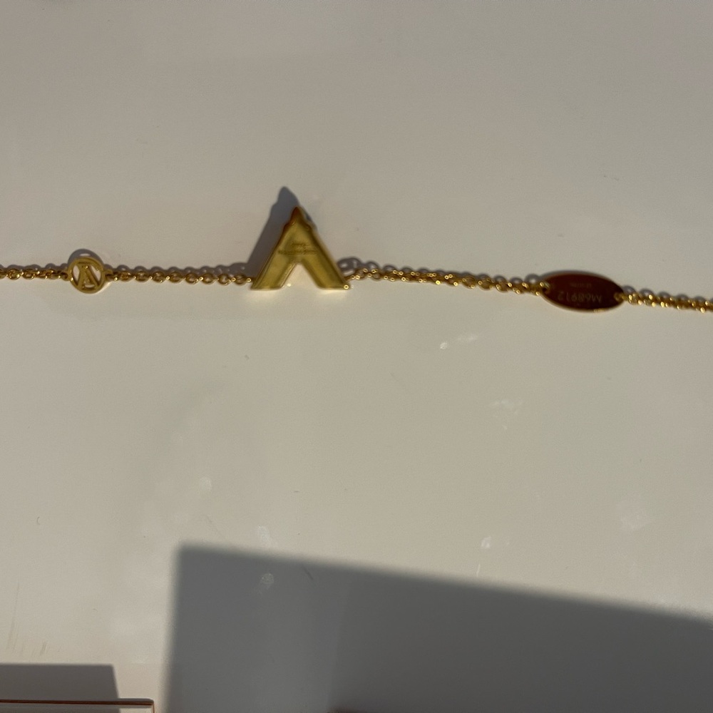 Authentic Louis Vuitton V monogram bracelet with baguette diamond.